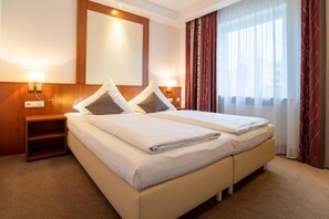 Desk, laptop workspace, blackout drapes, iron/ironing board