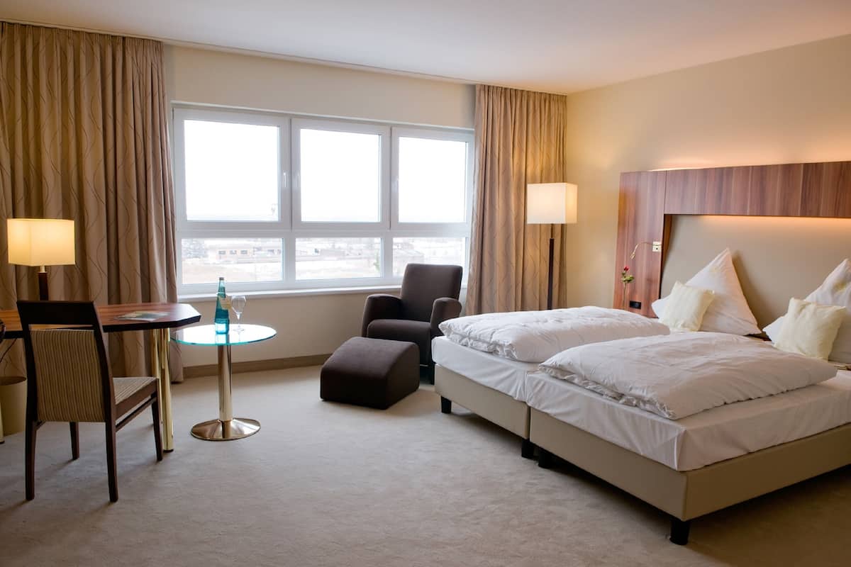 Chambre exclusive double ou avec lits jumeaux | Literie hypoallergénique, couette en duvet, minibar, coffre-fort