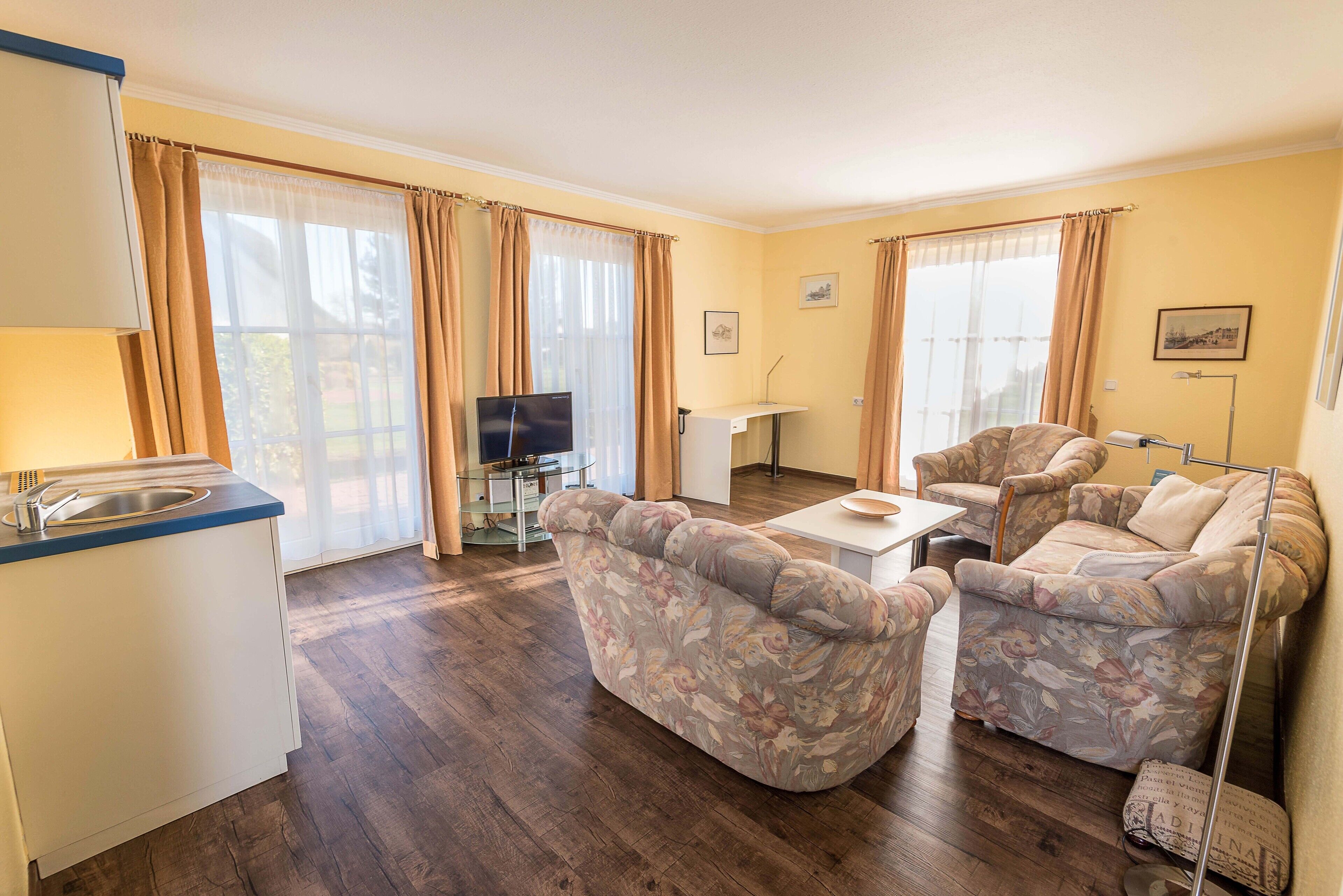 suite, 2 double beds | living area | tv, heated floors