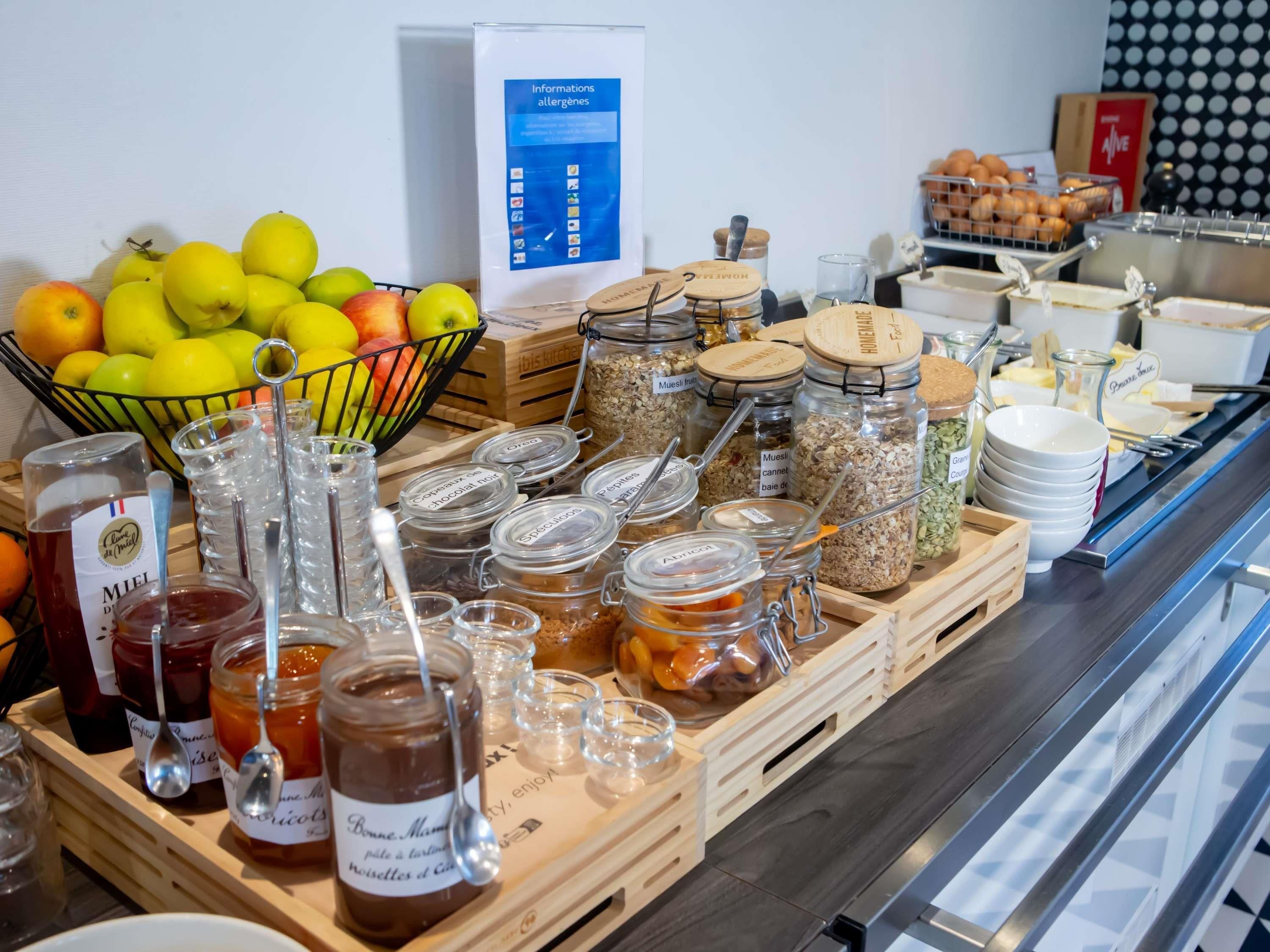 A breakfast buffet with various food items and condiments.