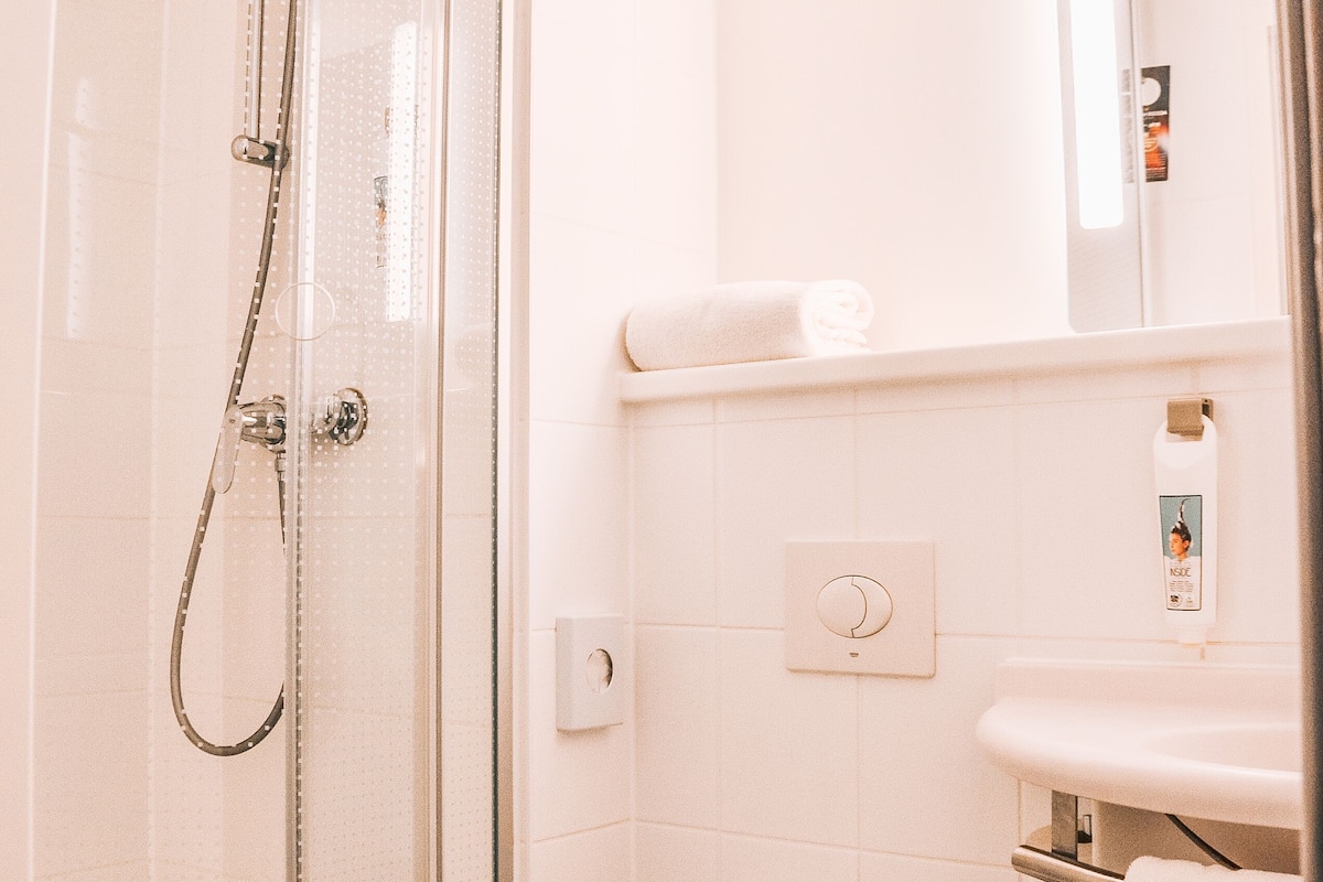 shower, eco-friendly toiletries, hair dryer, towels