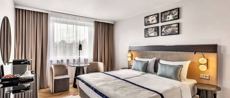 Hypo-allergenic bedding, minibar, in-room safe, desk