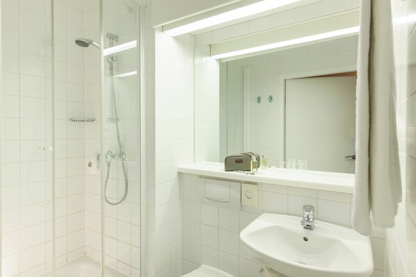 Shower, eco-friendly toiletries, hair dryer, towels