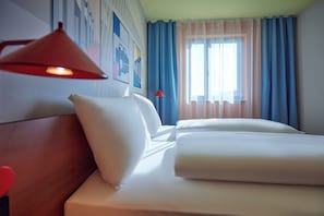 Premium bedding, desk, blackout drapes, soundproofing