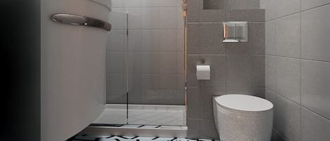 Un baño moderno con ducha, inodoro y lavamanos.