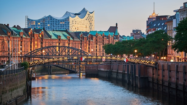A historic bridge over a river with a modern building in the background. - ibis Hamburg Alsterring (Hamburg)