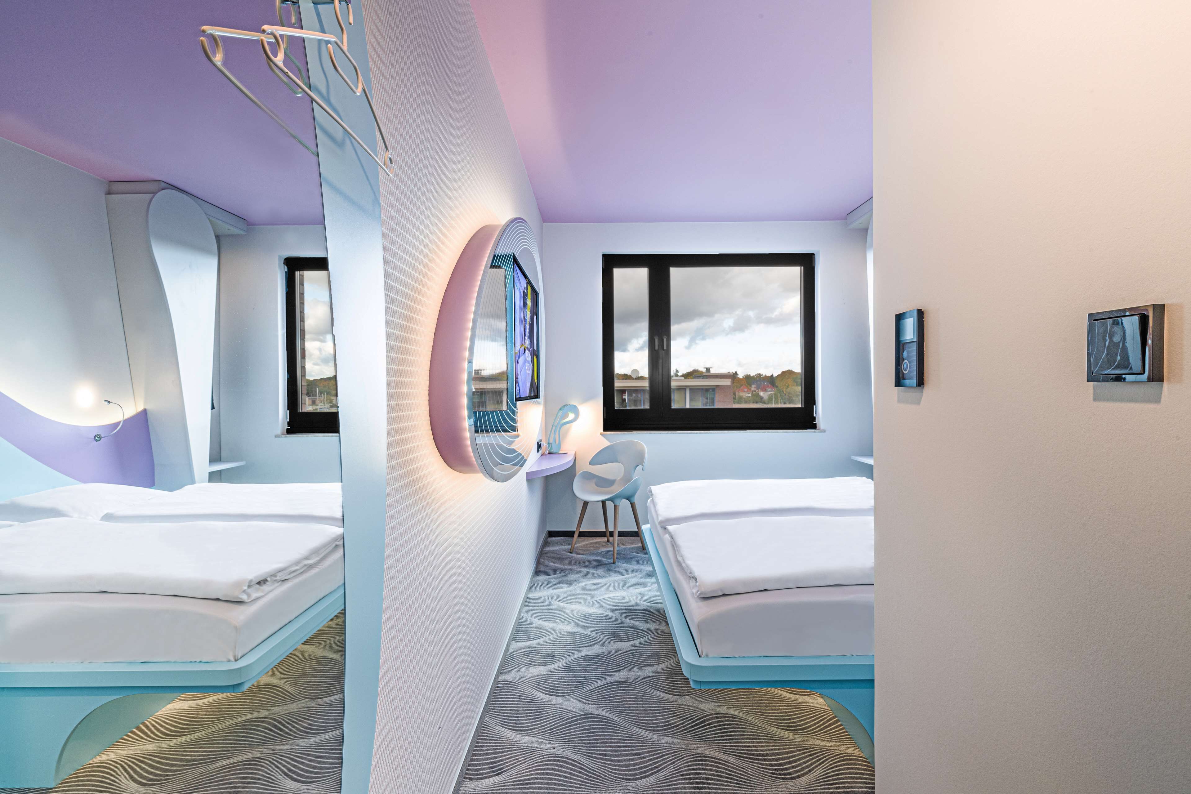 hypo-allergenic bedding, desk, laptop workspace, blackout curtains