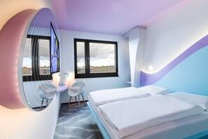 Hypo-allergenic bedding, desk, laptop workspace, blackout drapes