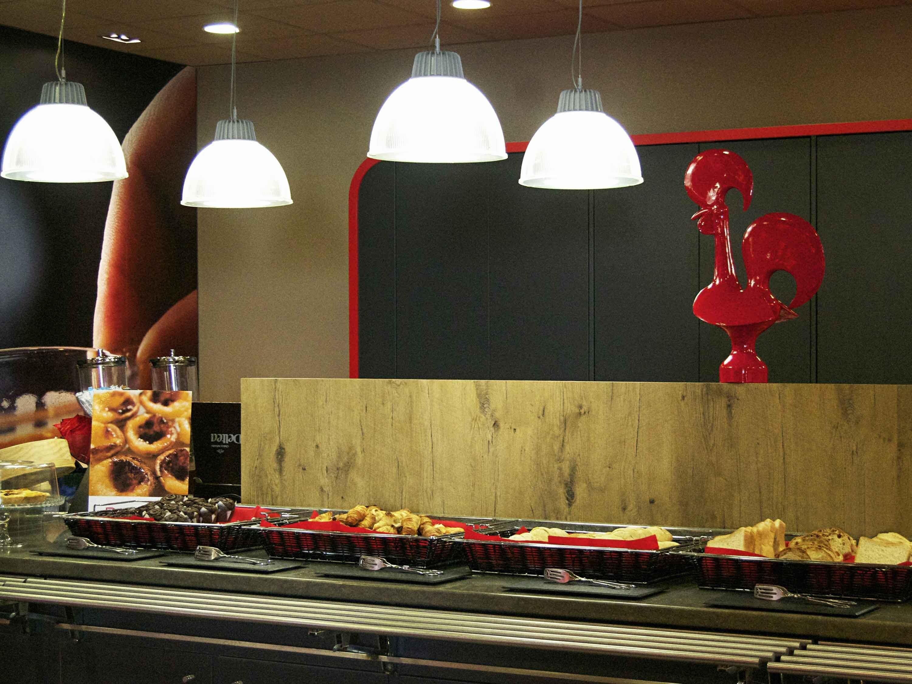 A buffet setup with various food items and a wooden counter.