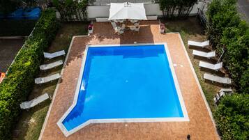 Outdoor pool, open 7:00 AM to 7:30 PM, sun loungers