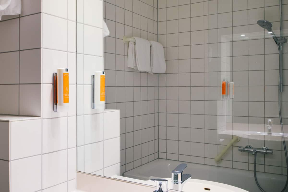 bathtub, hair dryer, towels