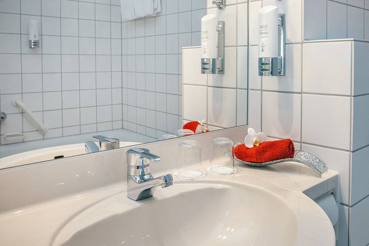 bathtub, hair dryer, towels