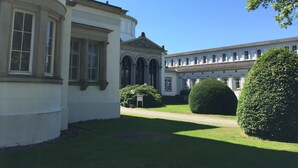 A classical building with a symmetrical facade, arched windows, and a central dome. - Mercure Hotel Bad Oeynhausen City (Bad Oeynhausen)