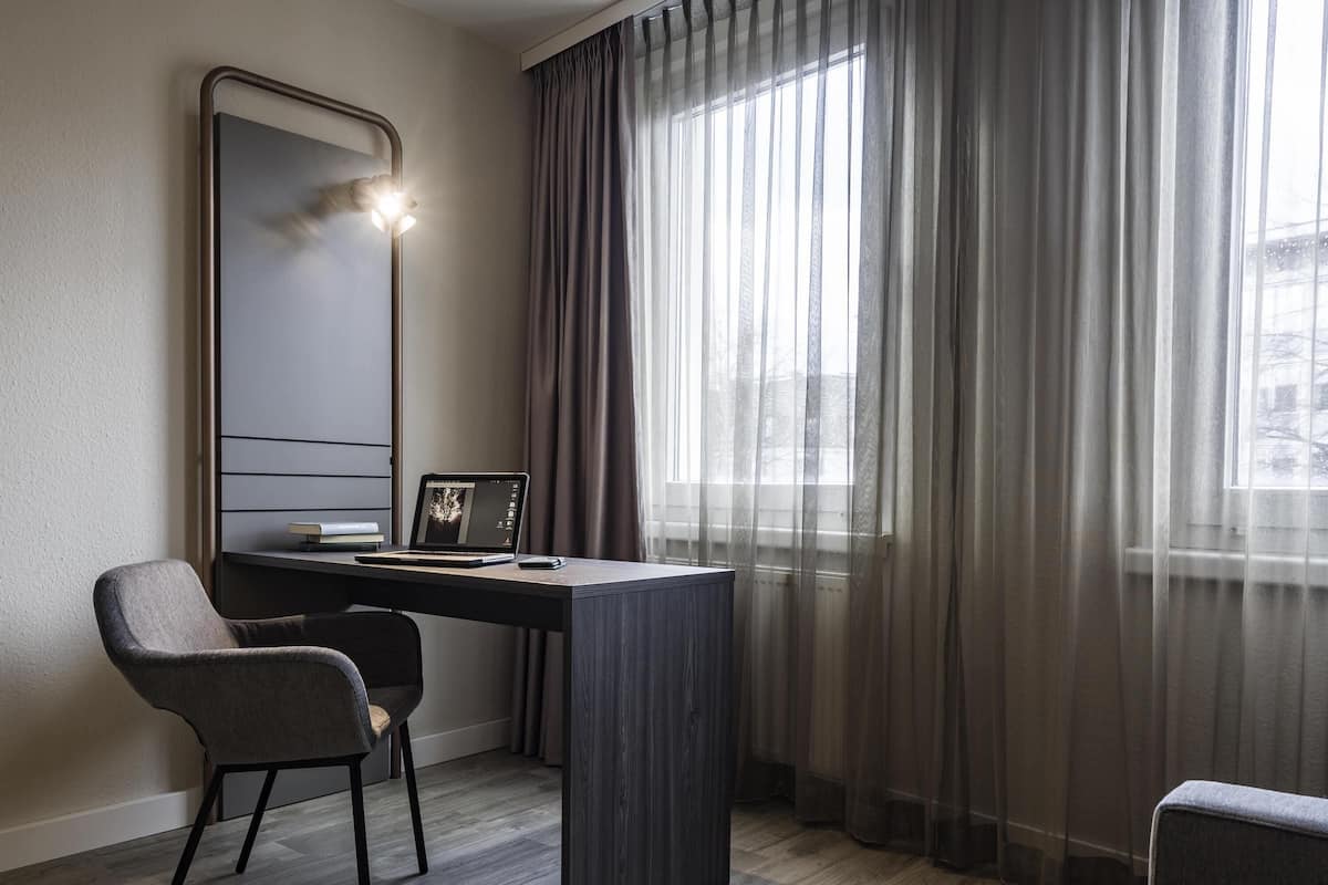 Desk, laptop workspace, blackout drapes, soundproofing