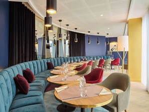 Enjoy dining in style with comfortable seating and elegant table settings.