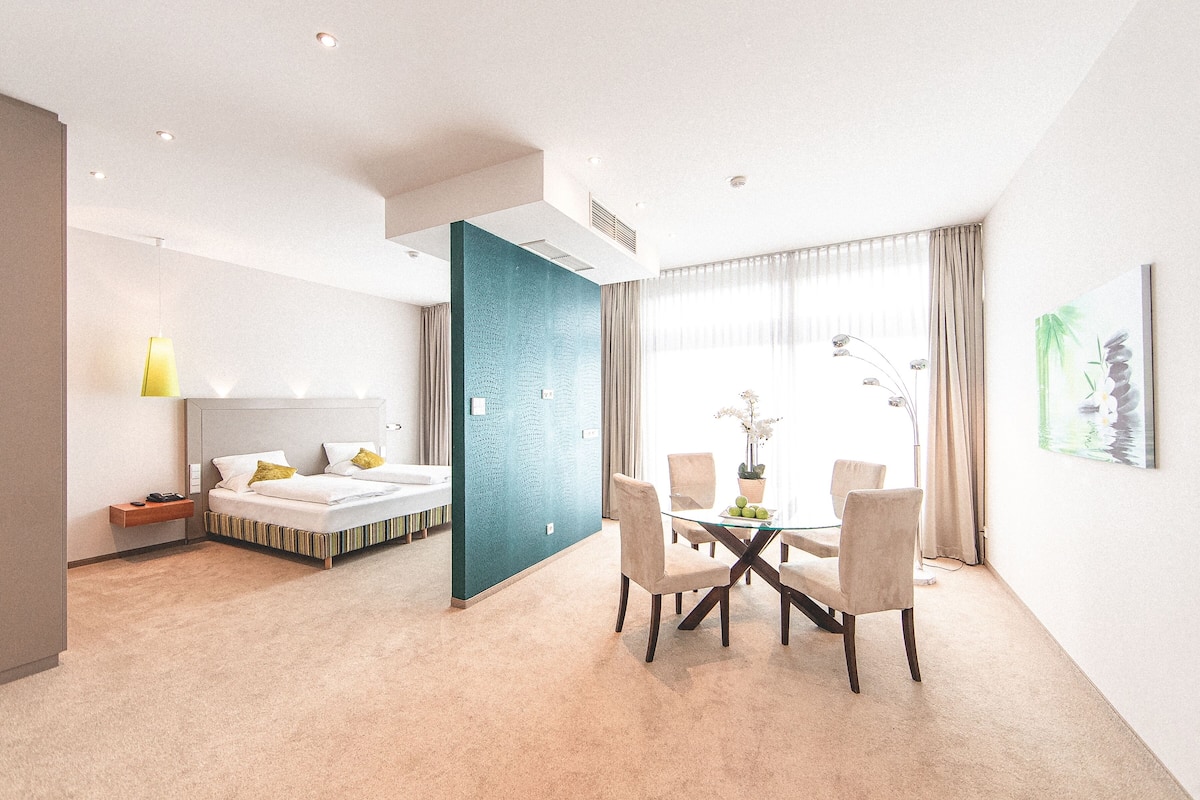 Suite | Living area | Flat-screen TV, pay movies