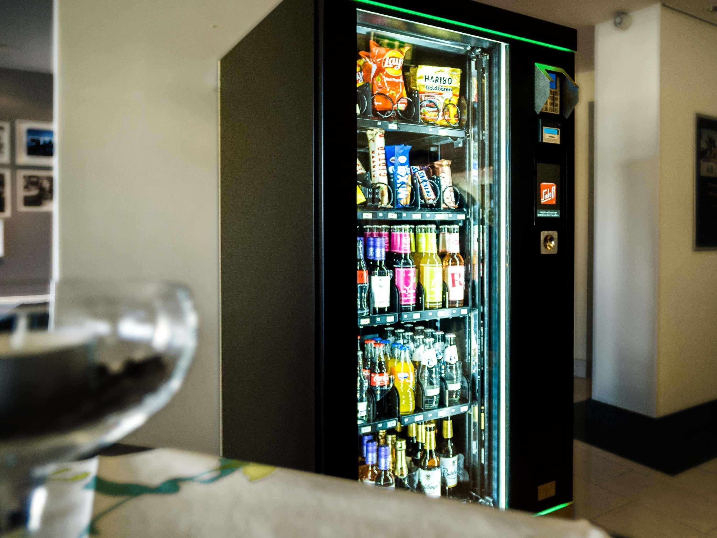 A vending machine with snacks and beverages.