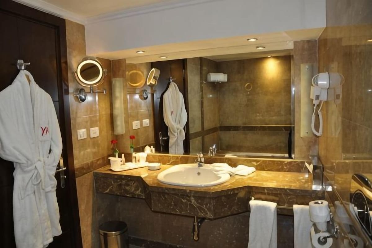 Bathroom | Combined shower/tub, spring water tub, designer toiletries, hair dryer