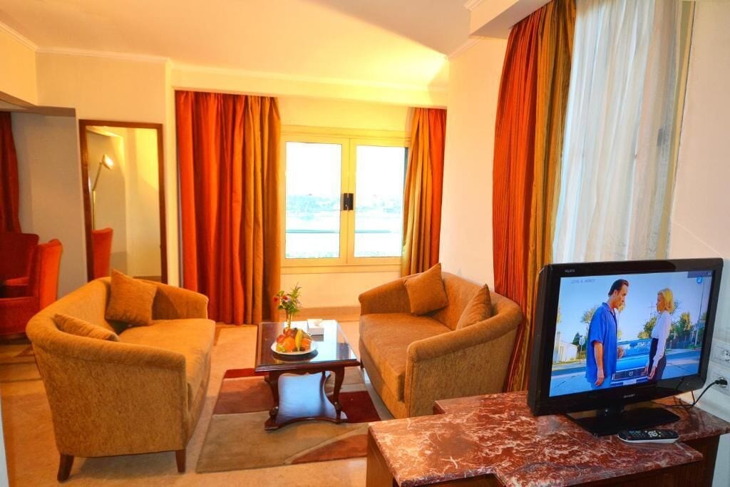 suite, river view | living area | 21-inch lcd tv with satellite channels, tv