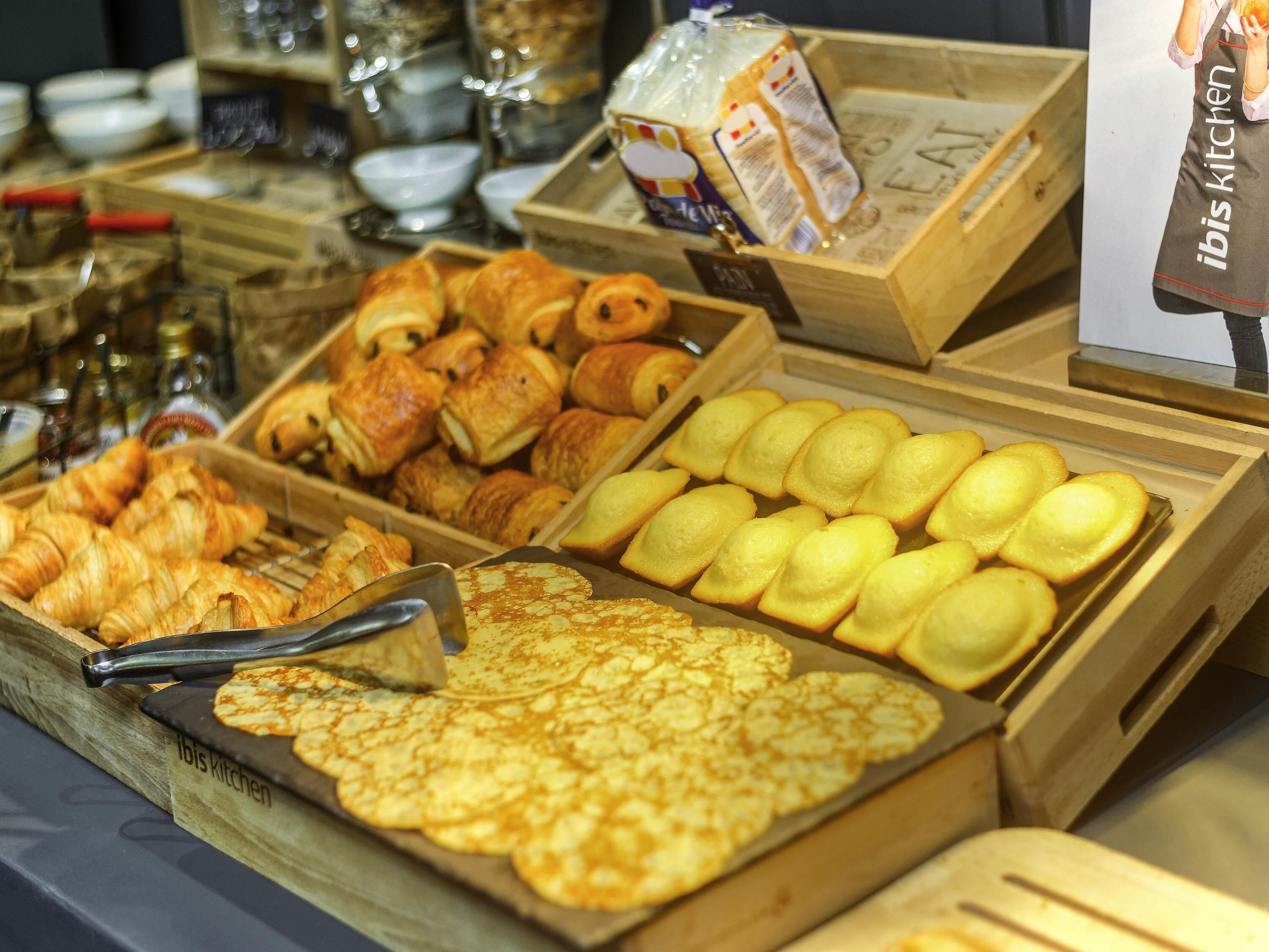 A bakery display with various baked goods.