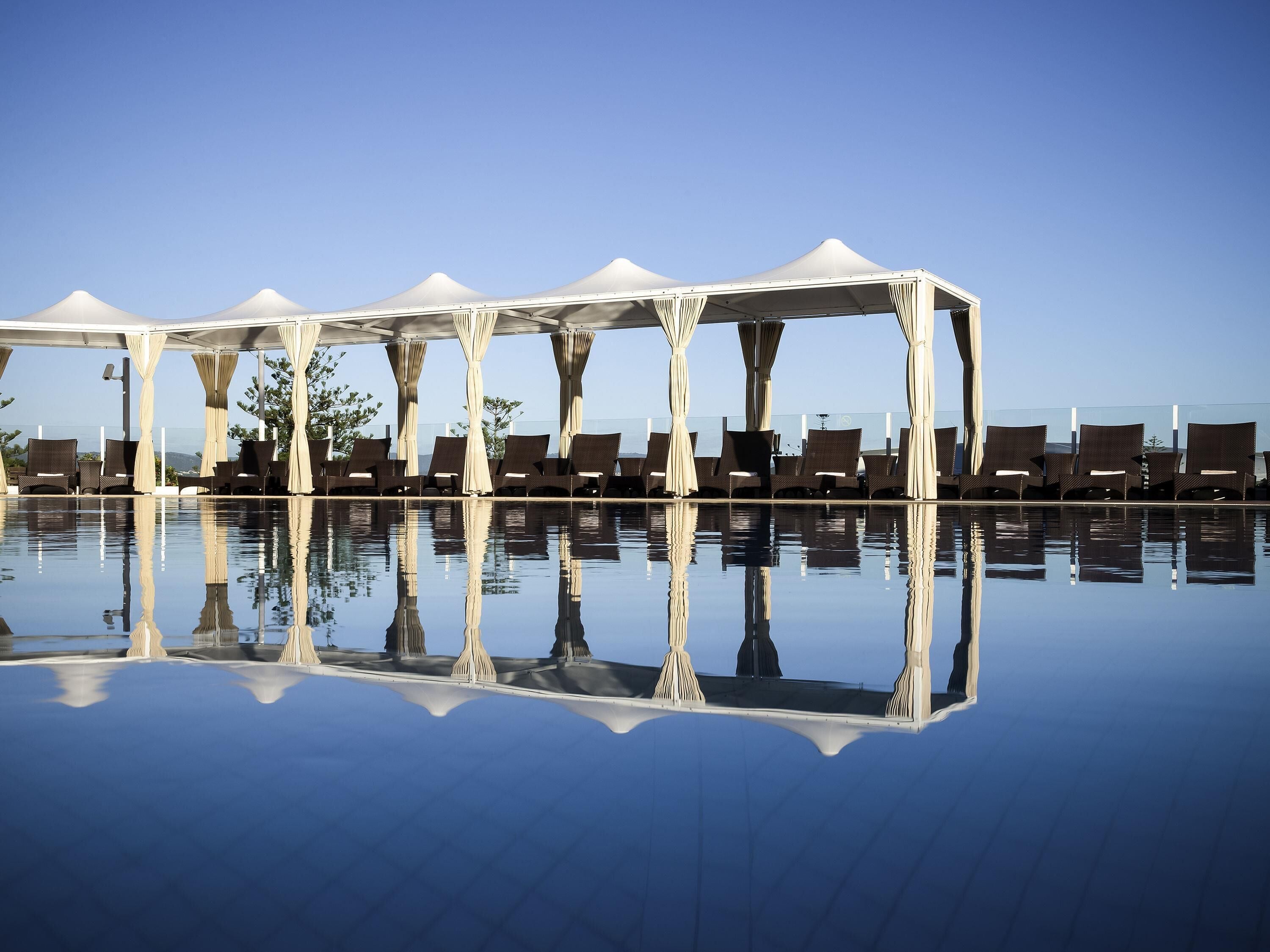 2 outdoor pools, open 6:00 AM to 6:00 PM, free pool cabanas