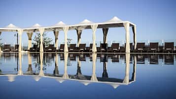 2 outdoor pools, open 6:00 AM to 6:00 PM, free pool cabanas