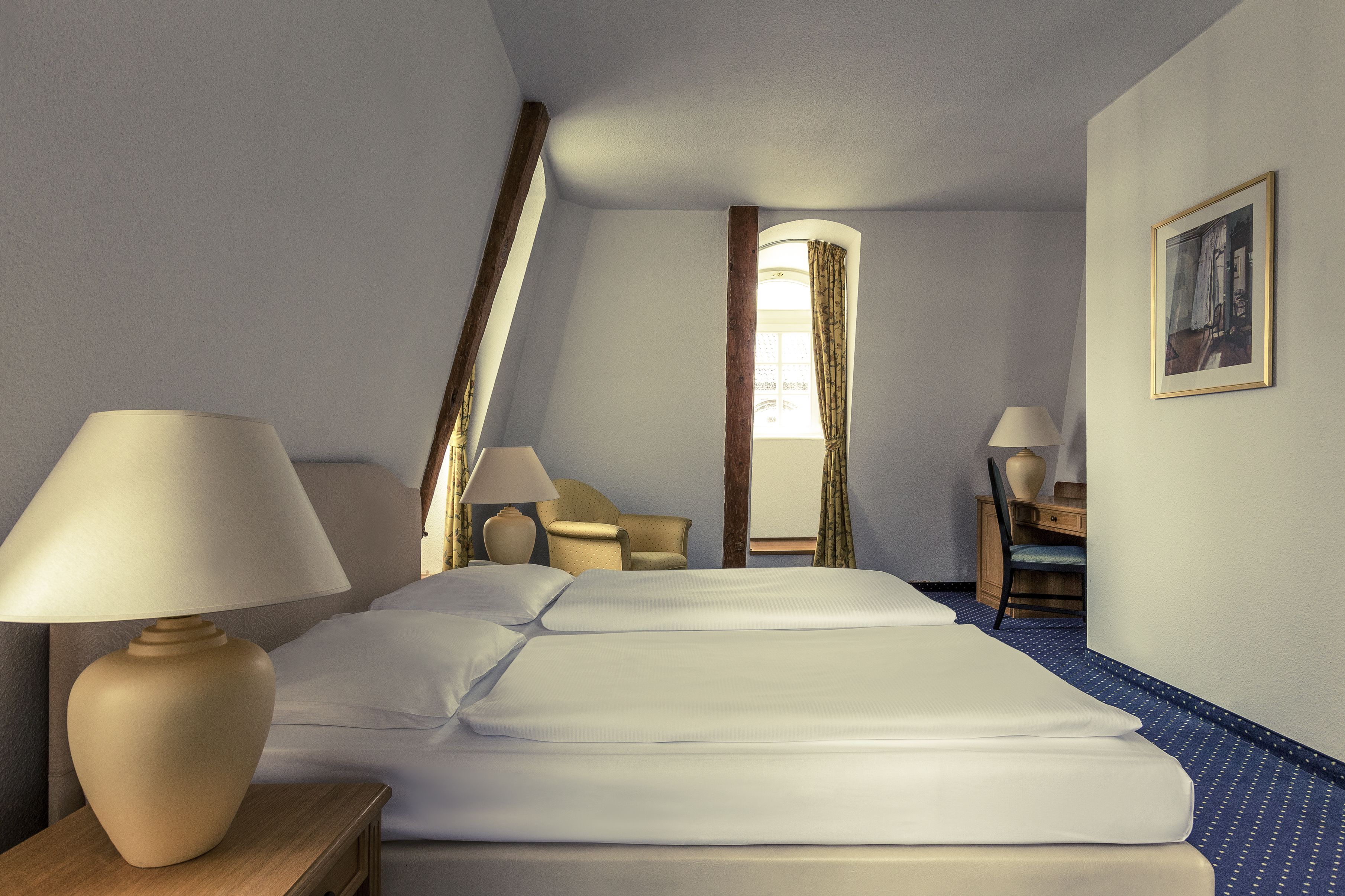 hypo-allergenic bedding, desk, blackout curtains, soundproofing