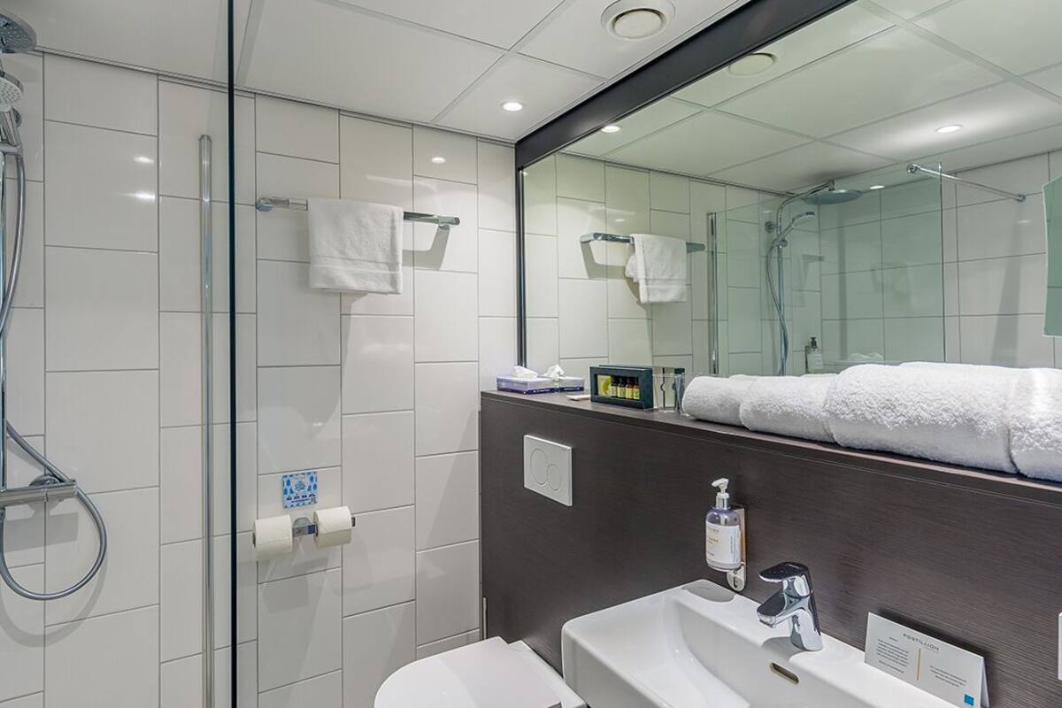 comfort room, 1 queen bed, terrace | bathroom | hair dryer, towels, soap, shampoo