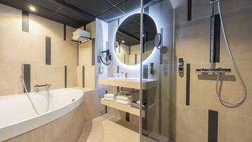 Separate bathtub and shower, free toiletries, hair dryer, towels