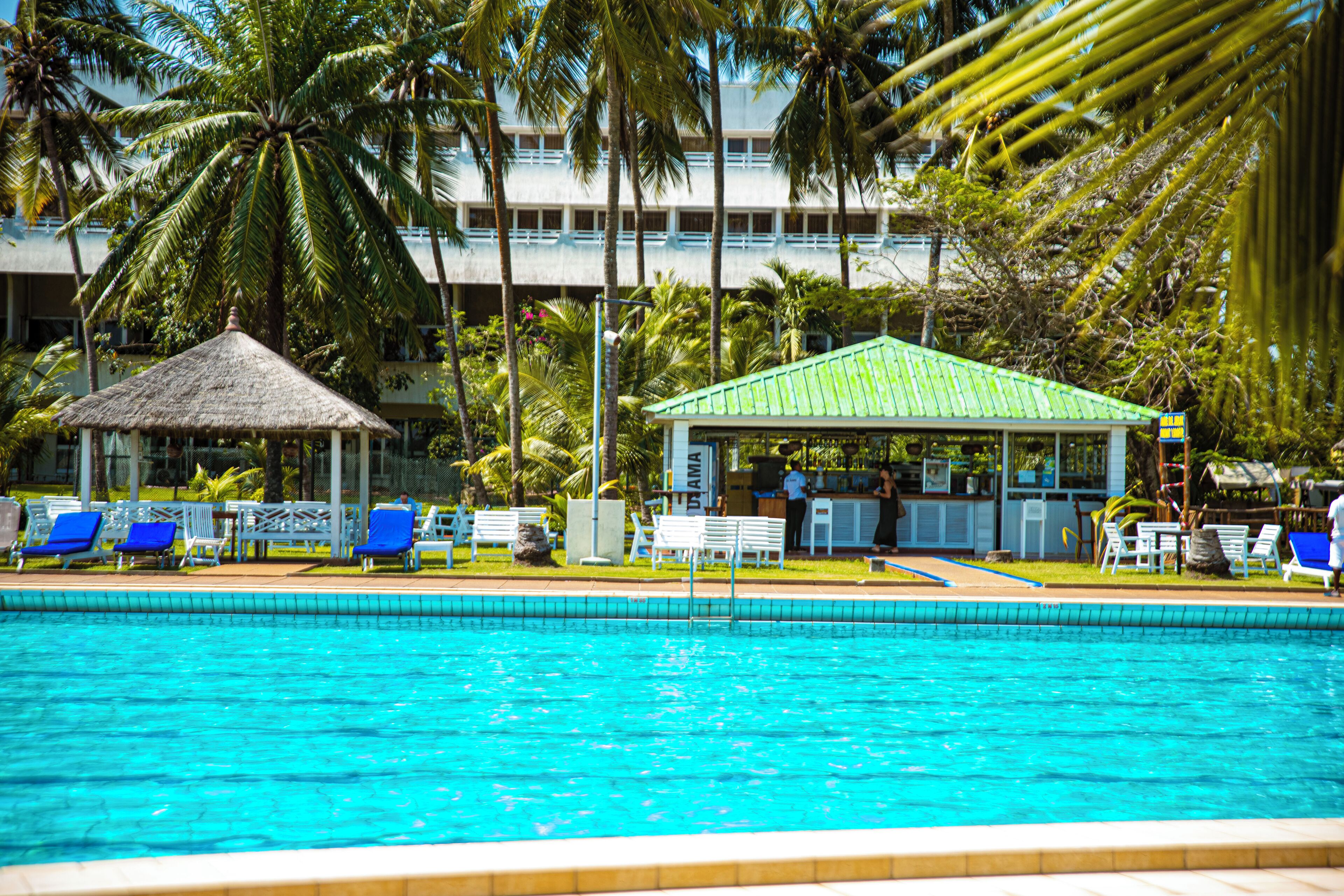 Outdoor pool, open 7 AM to 8 PM, pool umbrellas, sun loungers