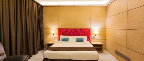 Habitación Deluxe | Minibar, caja fuerte, escritorio y sistema de insonorización