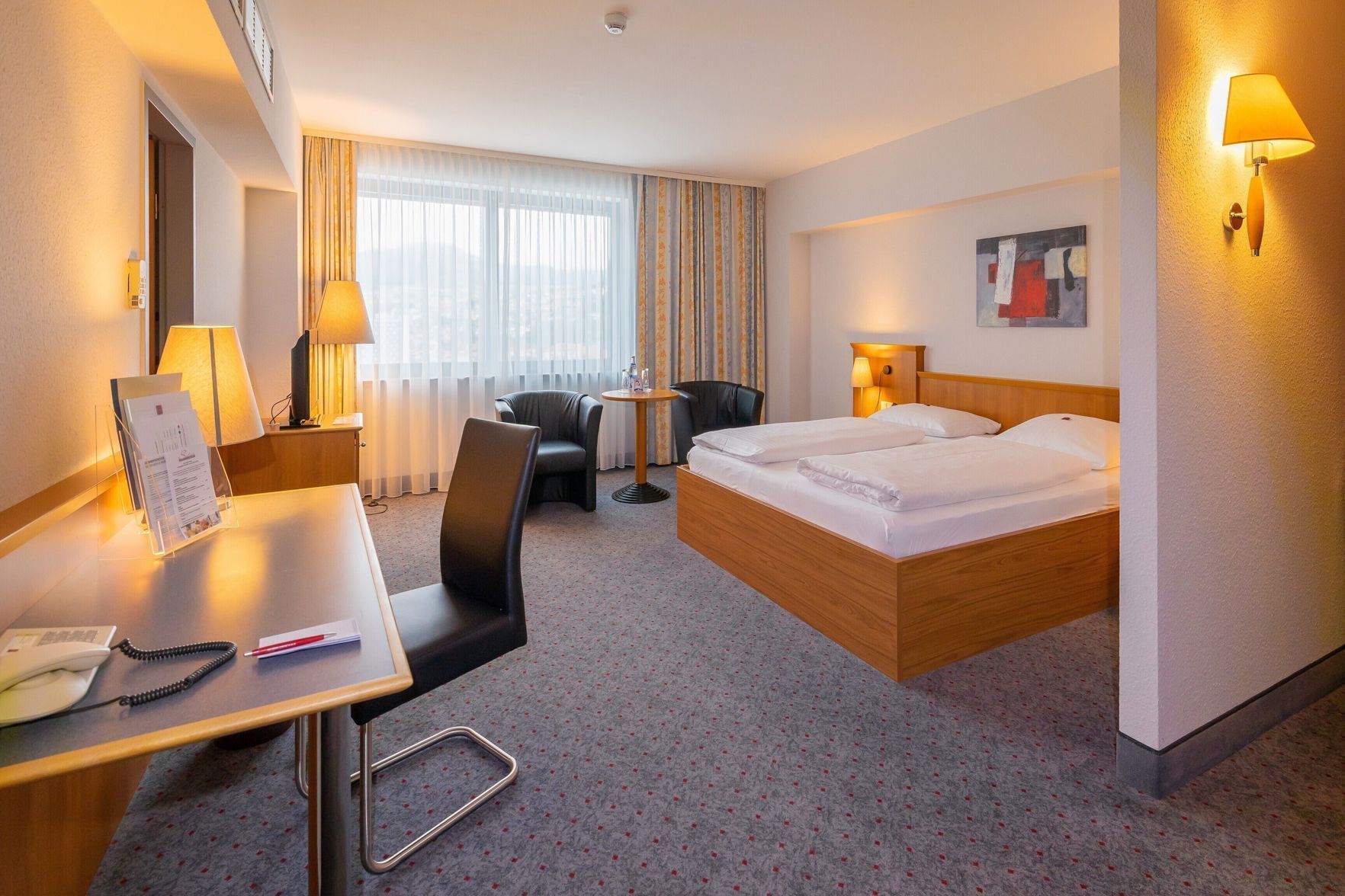 Hypo-allergenic bedding, in-room safe, desk, laptop workspace