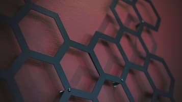 A close-up of a geometric metal wall art piece.