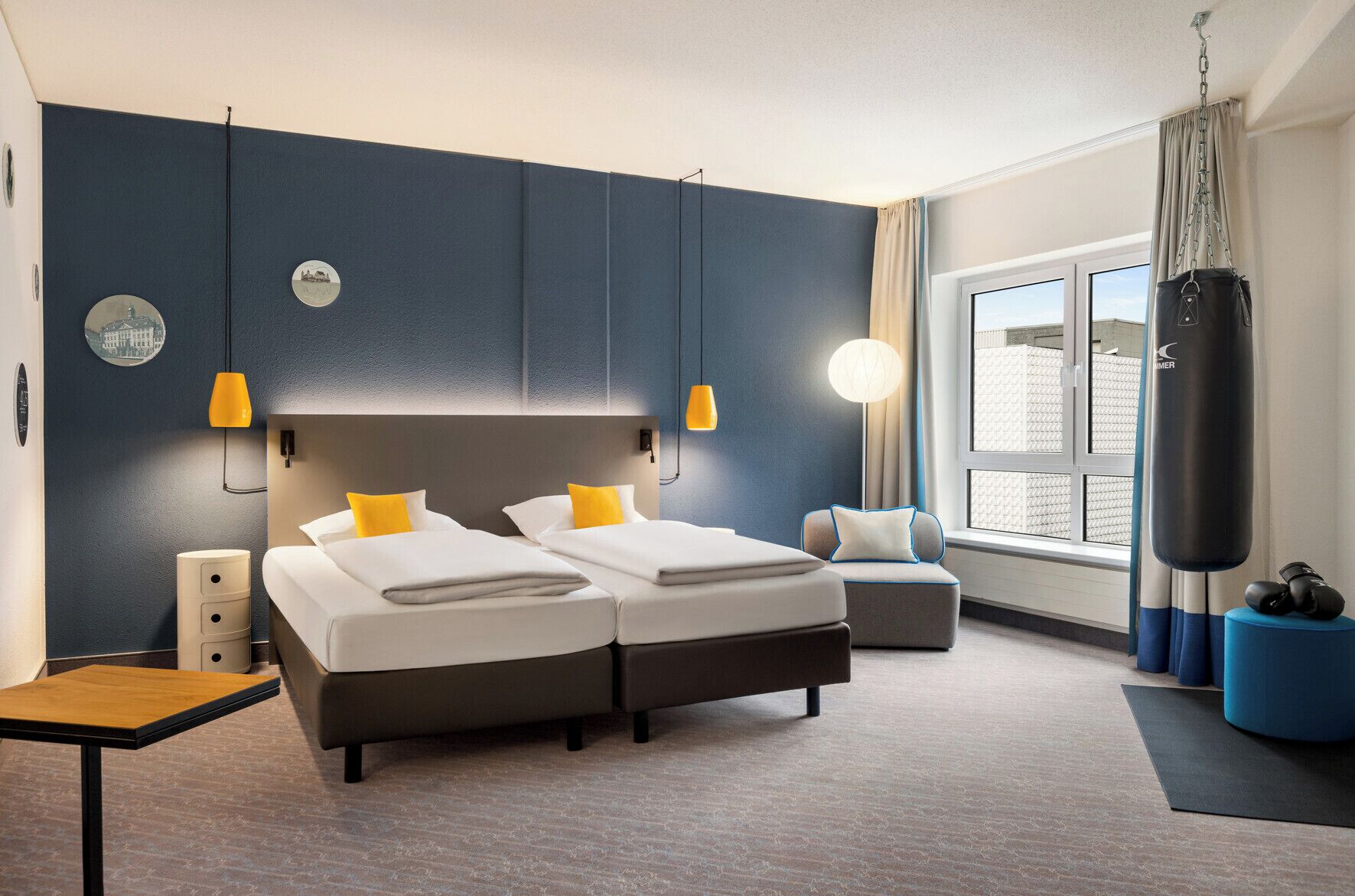 Hypo-allergenic bedding, desk, laptop workspace, blackout drapes