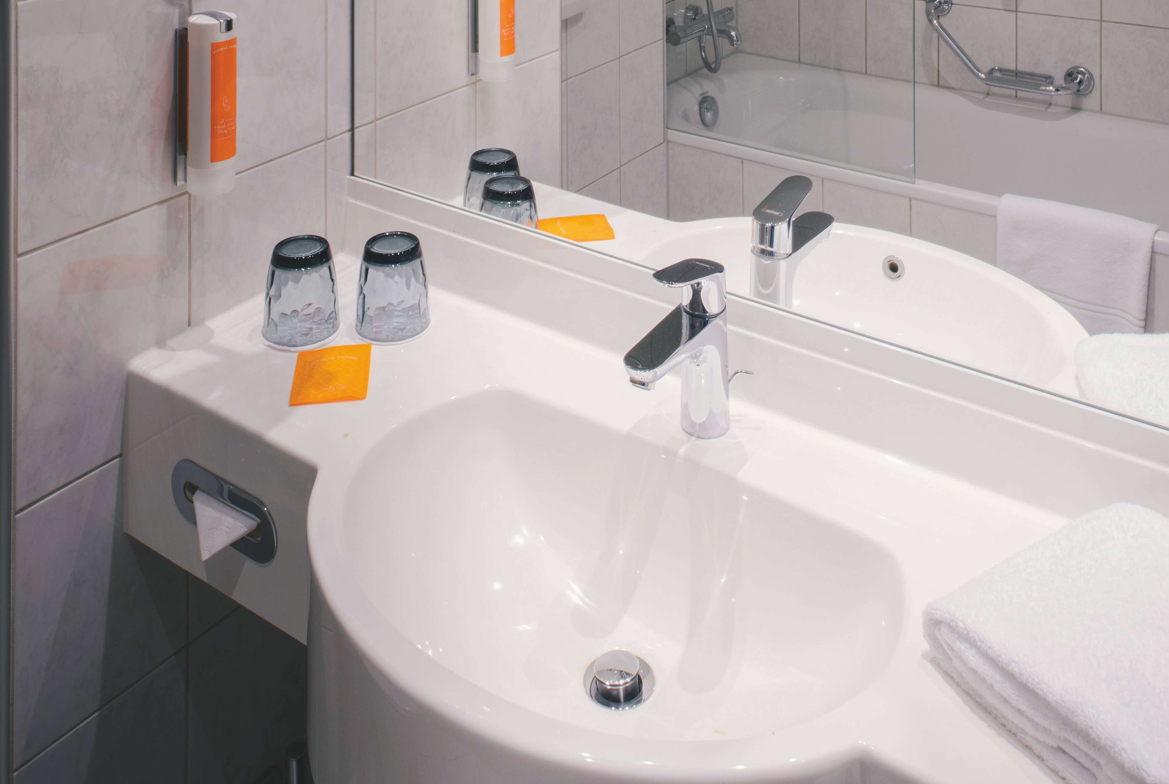 combined shower/bathtub, deep-soaking bathtub, hair dryer, towels