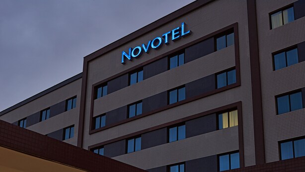 A hotel with a modern facade, multiple floors, and a prominent 'NOVOTEL' sign. - Novotel Sao Paulo Center Norte (São Paulo)
