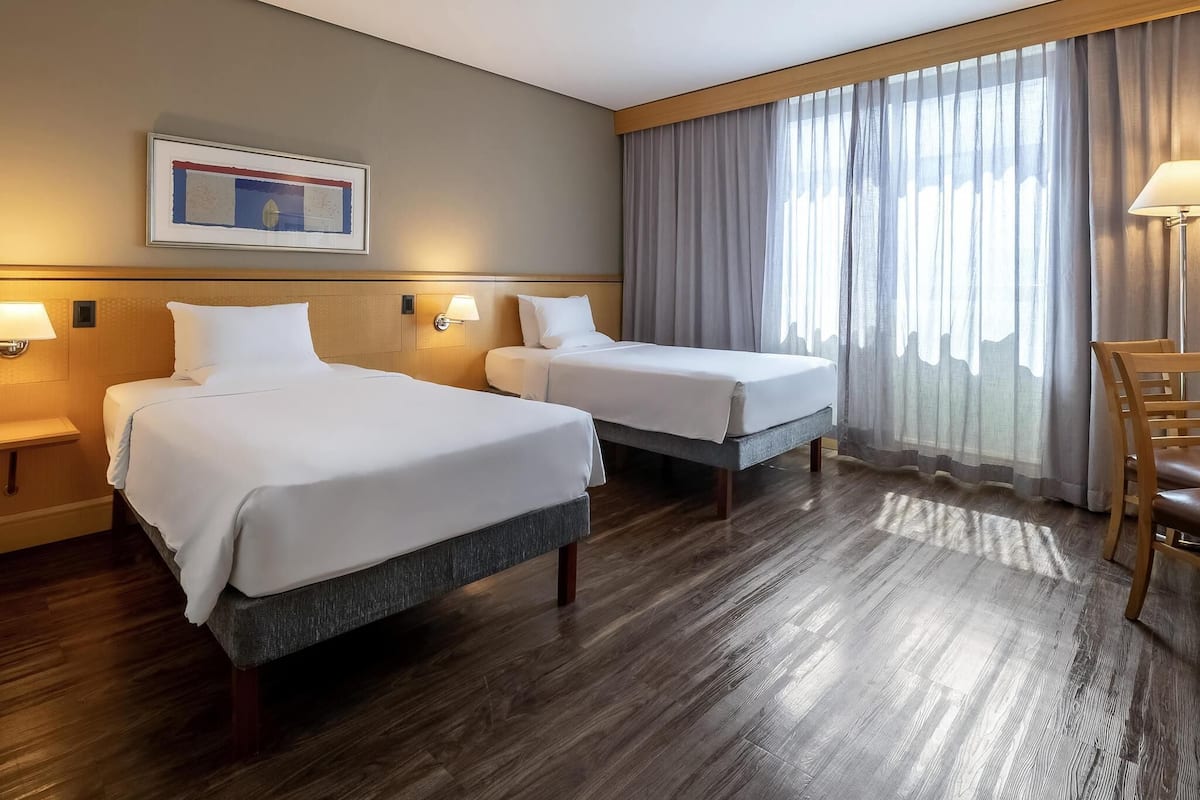Standard Apartment, 2 Twin Beds | Minibar, in-room safe, desk, blackout drapes