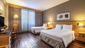 Standard Room, Multiple Beds | Minibar, in-room safe, desk, blackout drapes