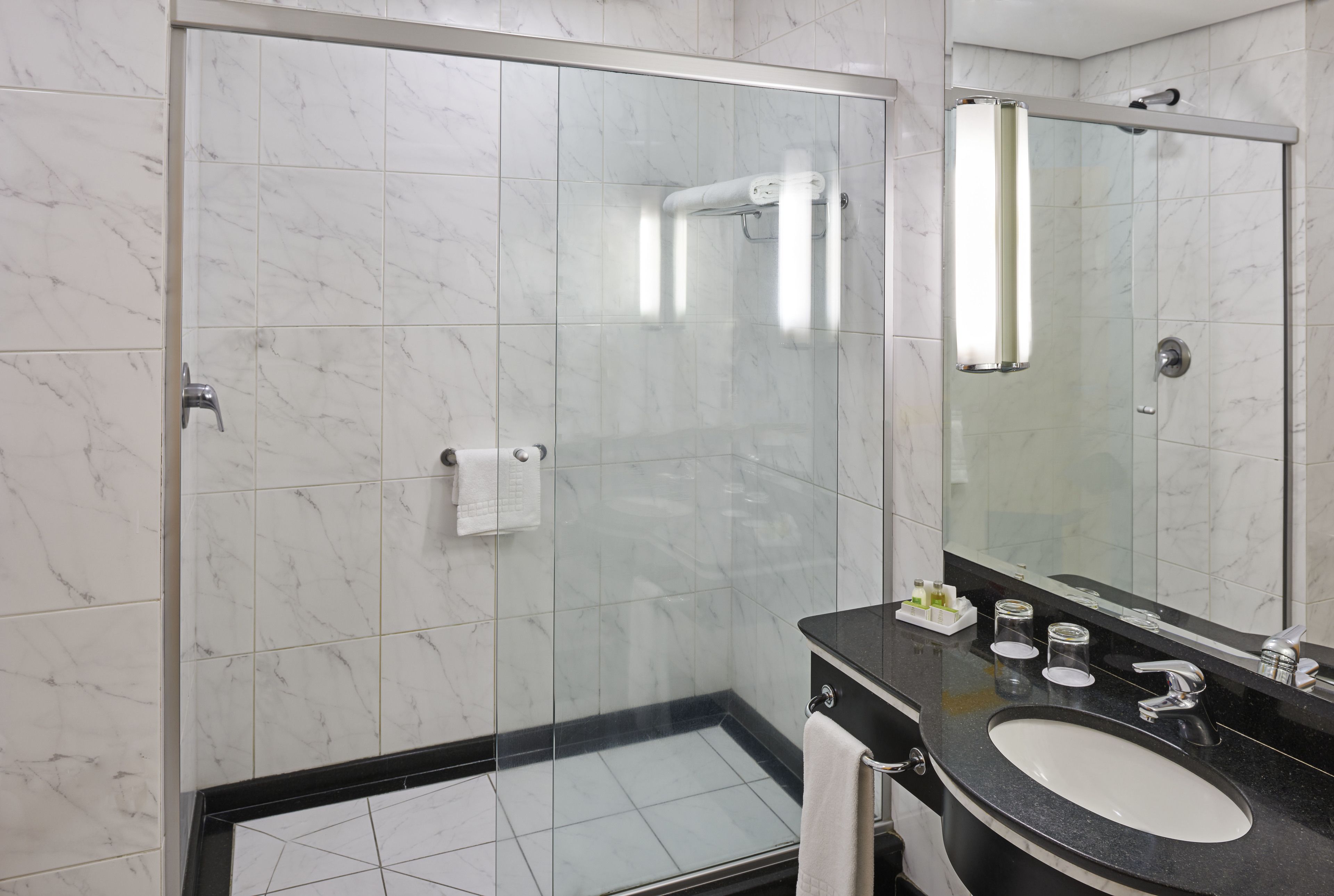 shower, eco-friendly toiletries, hair dryer, towels