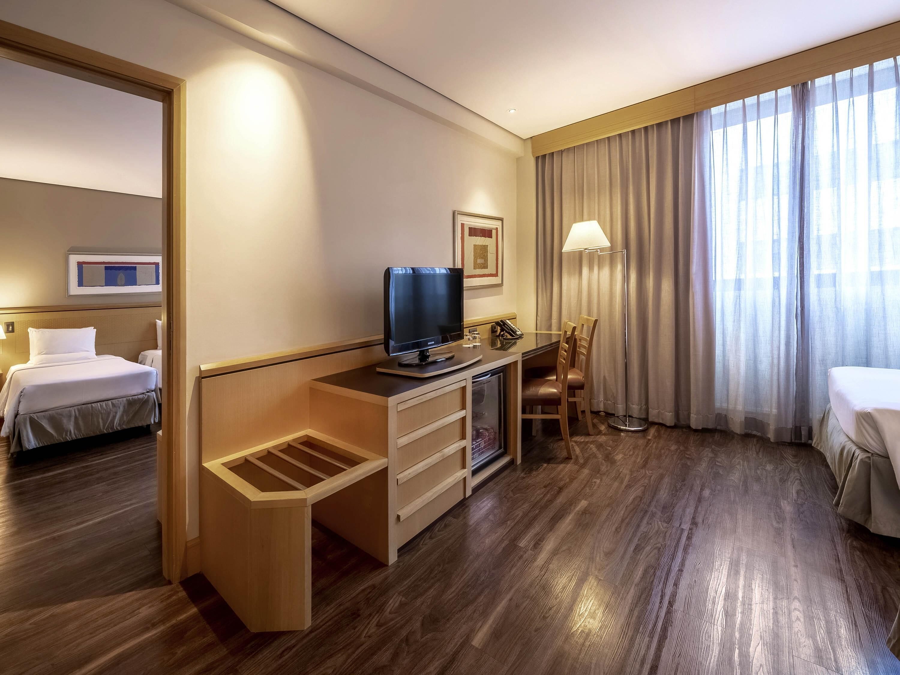 Family Room, Multiple Beds | Minibar, in-room safe, desk, blackout drapes