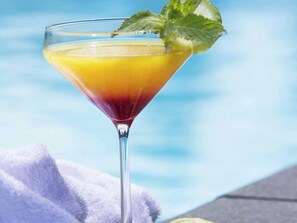 Seasonal outdoor pool, open 8:00 AM to 8:30 PM, pool loungers