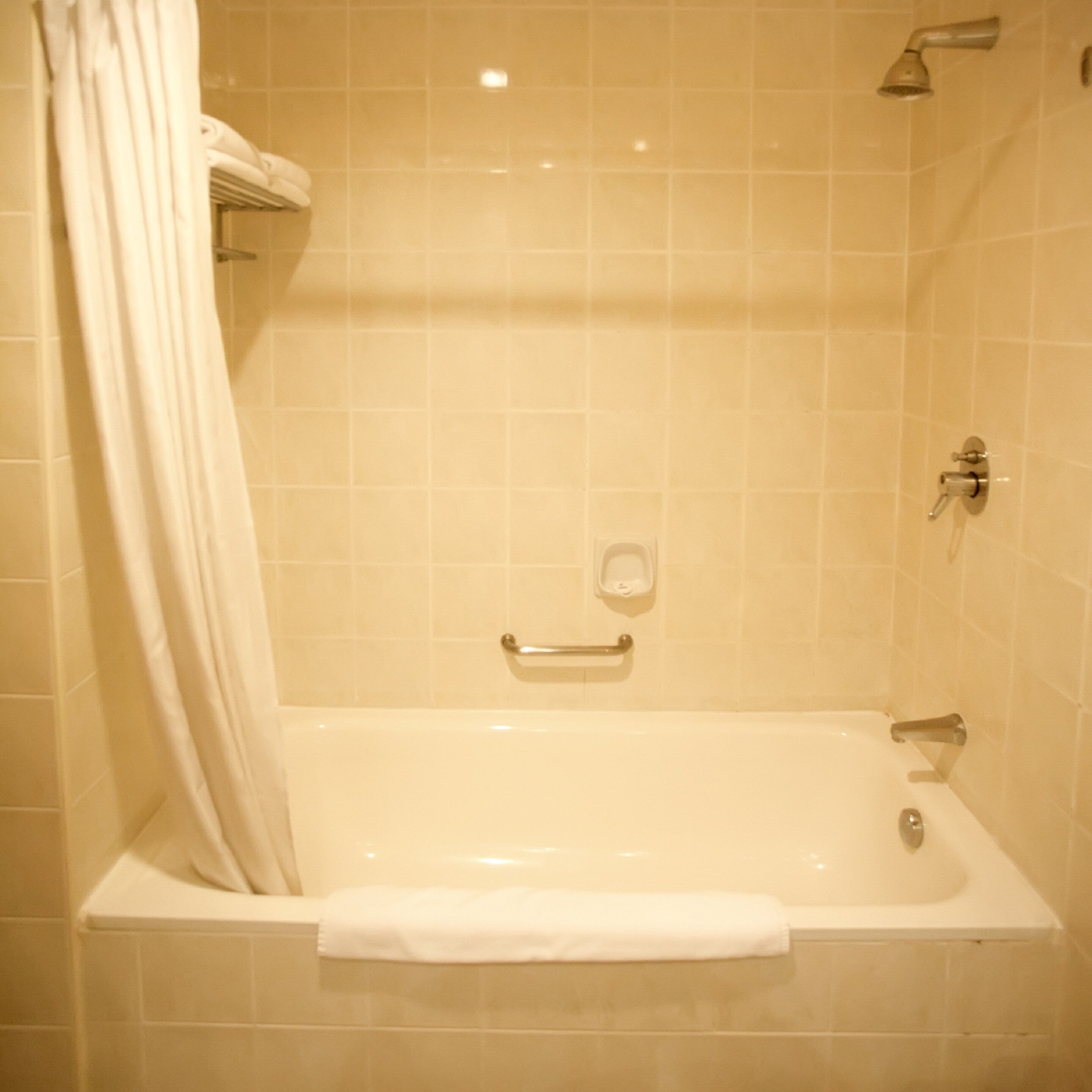 bathtub, rainfall showerhead, free toiletries, hair dryer