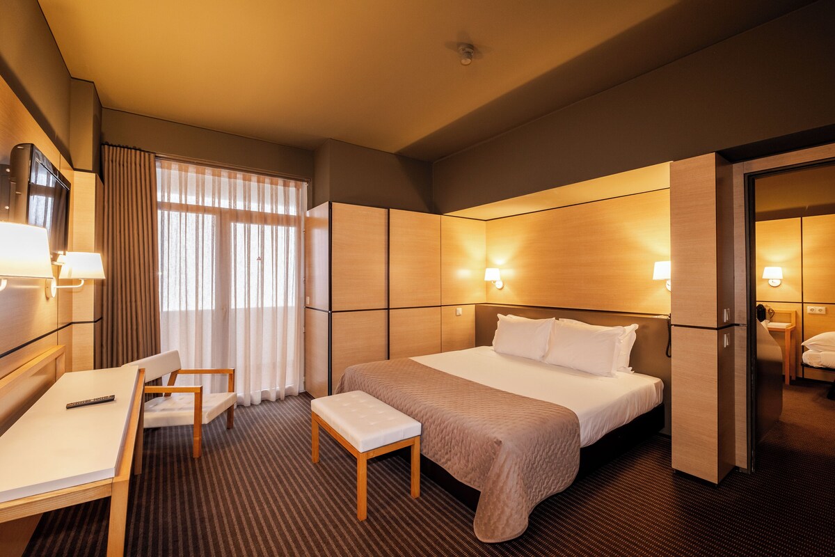 Triple Suite, Sea View | Minibar, in-room safe, desk, blackout drapes