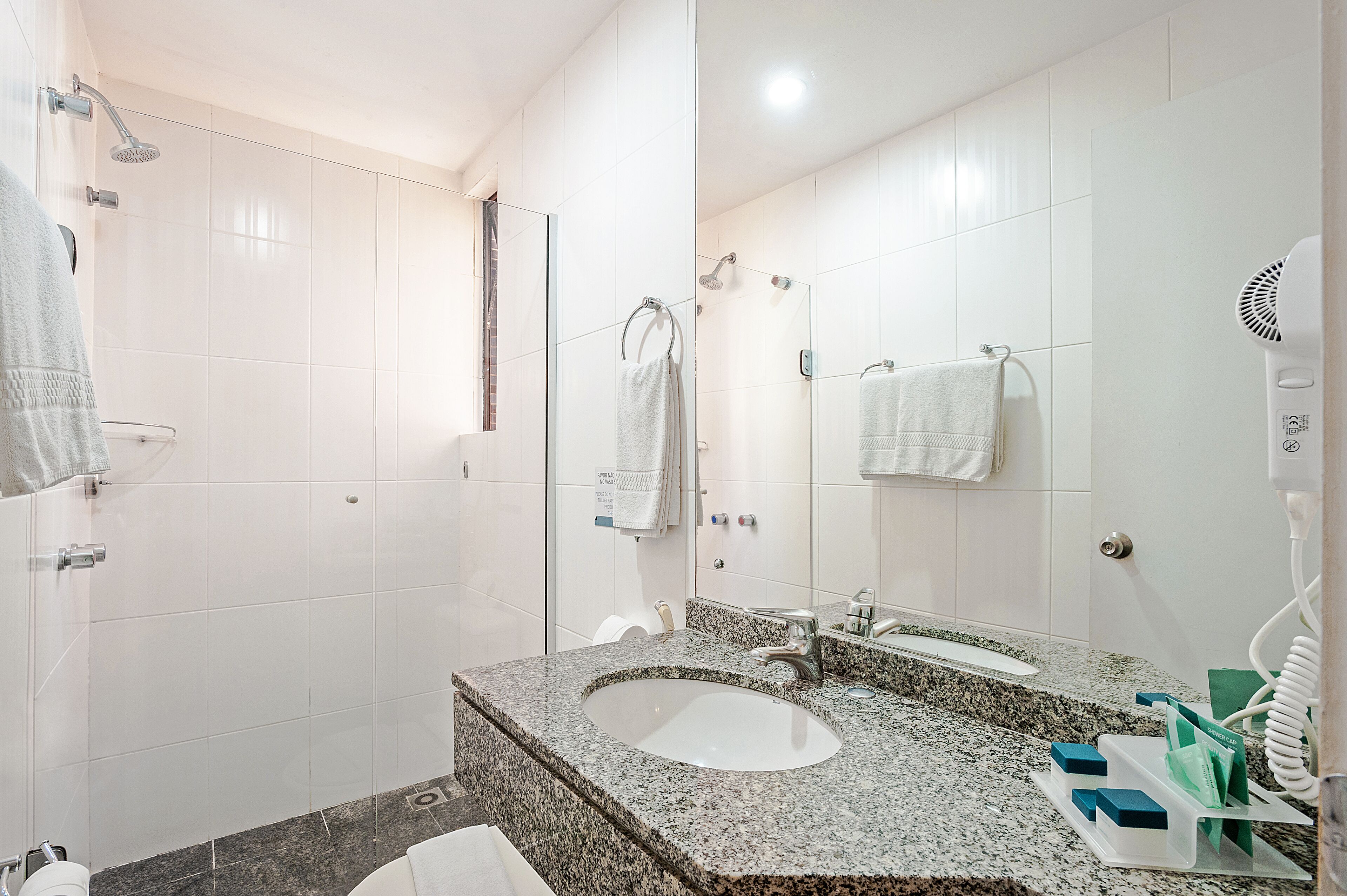 deluxe room | bathroom | shower, free toiletries, hair dryer, towels