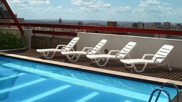 Outdoor pool, open 6:00 AM to 10:00 PM, sun loungers