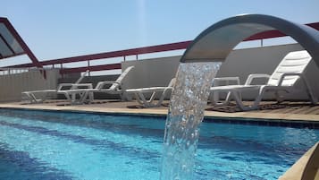 Outdoor pool, open 6:00 AM to 10:00 PM, sun loungers