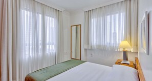 Standard Room, 1 Queen Bed, Kitchenette (42SQM, Free WiFi, Living Room) | 2 bedrooms, minibar, in-room safe, blackout drapes