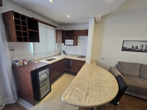 Family Apartment, 1 Double Bed, Kitchen | Private kitchen | Coffee/tea maker, eco-friendly cleaning products