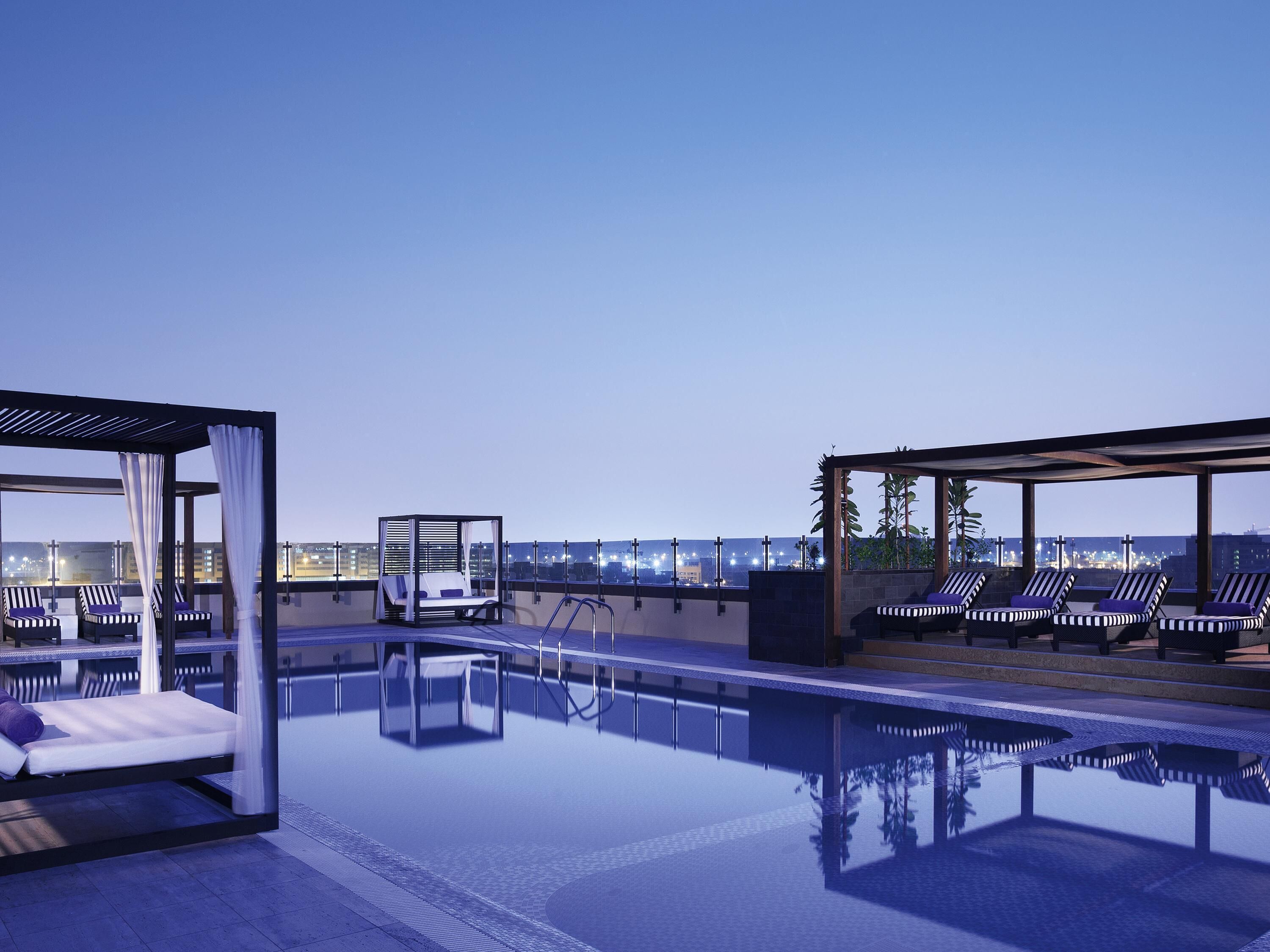 Outdoor pool, open 6:30 AM to 10:00 PM, free pool cabanas