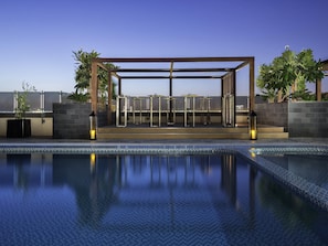 Outdoor pool, open 10:00 AM to 6:00 PM, free cabanas, pool umbrellas